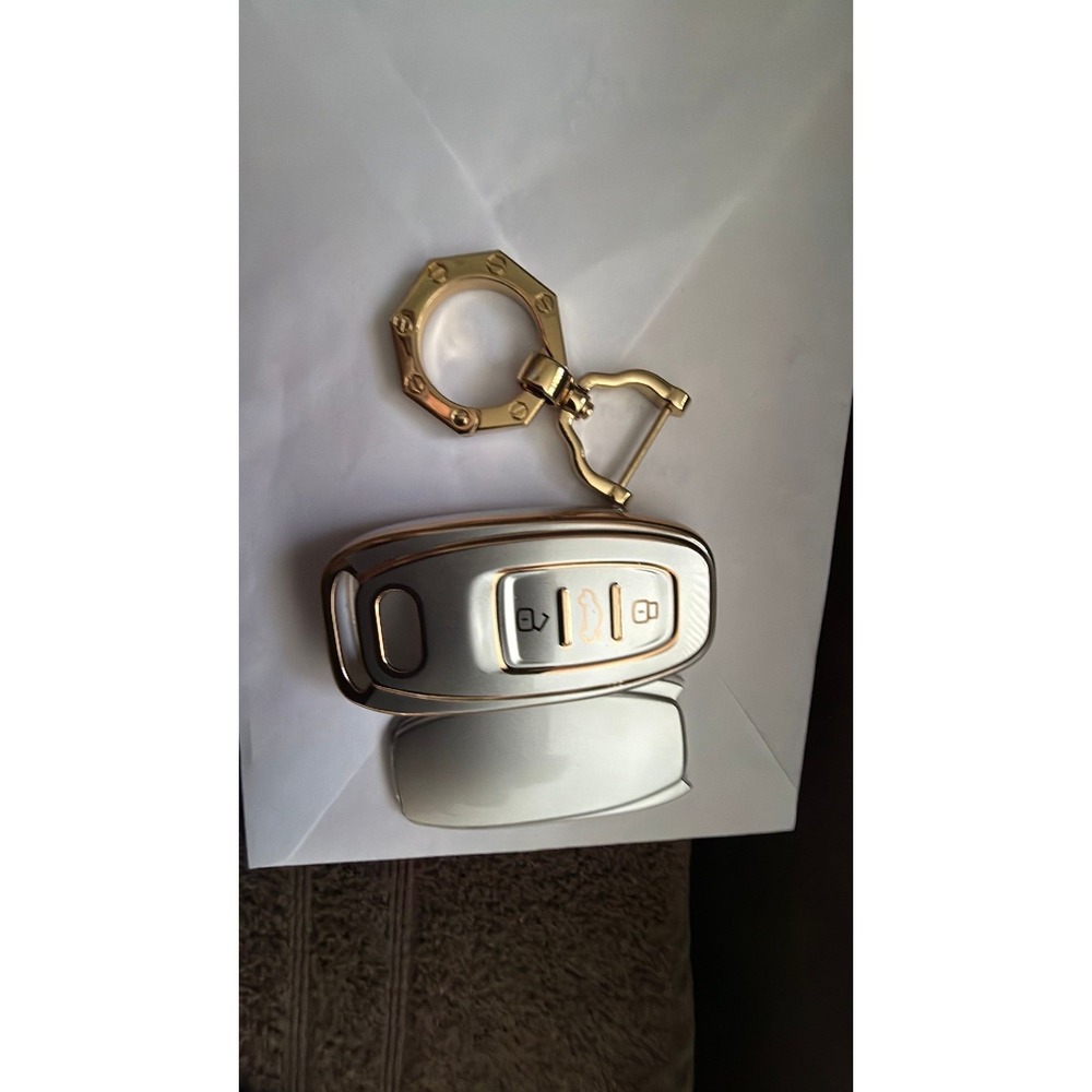 8. Gold silver tone key fib cover
